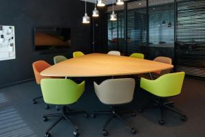 a conference room with a wooden table and chairs at citizenM Washington Capital in Washington