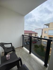 a balcony with a view of a parking lot at Vasiljević Apartman Koviljača in Banja Koviljača