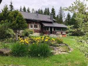 a house with a garden in front of it at Villa Anna in Guta +23 photos