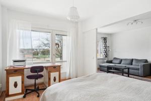 En eller flere senge i et værelse på Bright and spacious apartment