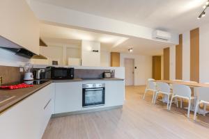 Kuchyň nebo kuchyňský kout v ubytování Confortevole Stanza 6 con bagno privato Stazione