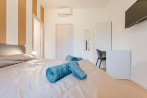 Ένα ή περισσότερα κρεβάτια σε δωμάτιο στο Camera 7 per gruppi e viaggiatori - Stazione