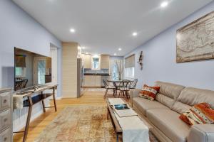 a living room with a couch and a table at 2BR DOG-Friendly Apt in 2-Fam Home - Comfy Retreat in Boston