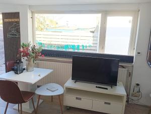 Μια τηλεόραση ή/και κέντρο ψυχαγωγίας στο Strandhuussie Texel