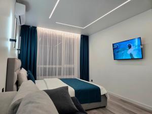 Ένα ή περισσότερα κρεβάτια σε δωμάτιο στο Belvedere Apart 2, parking