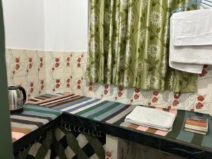 Ένα ή περισσότερα κρεβάτια σε δωμάτιο στο Tiny Spot Hostel Rishikesh