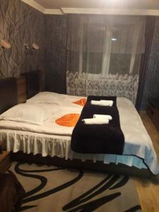 Giường trong phòng chung tại Dachi Apartment