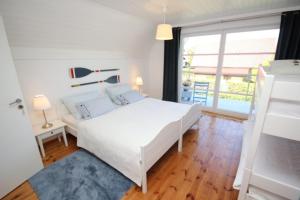Postel nebo postele na pokoji v ubytování Ferienhaus Düne
