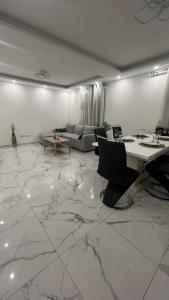 a living room with a table and a couch at Apartment Ebersheim France in Ebersheim