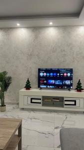 a living room with a large flat screen tv at Apartment Ebersheim France in Ebersheim +27 photos