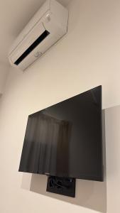 Un televizor și/sau centru de divertisment la Be RELAX TORREJON