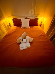a bed with two towels and two bottles on it at ASV Condo Staycation SMDC Breeze in Manila +18 photos