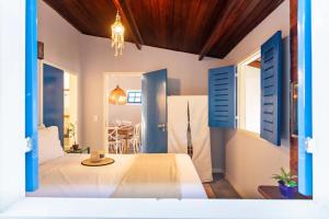 Ένα ή περισσότερα κρεβάτια σε δωμάτιο στο Quarto em Villa Blu Jeri +6 φωτογραφίες