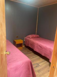 Ένα ή περισσότερα κρεβάτια σε δωμάτιο στο Cabaña centro