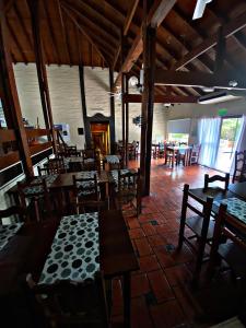 a dining room with tables and chairs in a building at Altos del Rincón in Merlo +7 photos