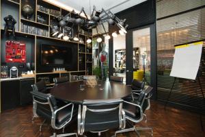a dining room with a table and chairs at citizenM Boston North Station in Boston