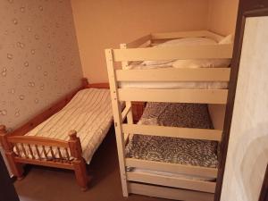 Ένα ή περισσότερα κρεβάτια σε δωμάτιο στο Au petit horizon