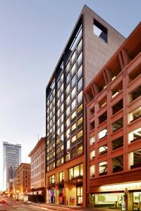 a large office building on a city street at citizenM San Francisco Union Square in San Francisco