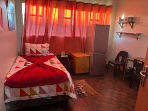 Giường trong phòng chung tại George M Properties Inn +6 ảnh