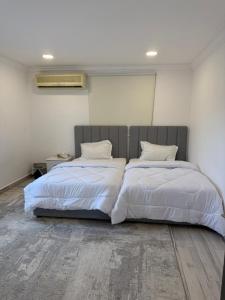 Ένα ή περισσότερα κρεβάτια σε δωμάτιο στο Farm house with all facilities in Al Dhaid , sharjah