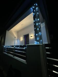 a mirror in a room with lights on it at BelAir Luxury Living - 'The One Villa' in Kardítsa