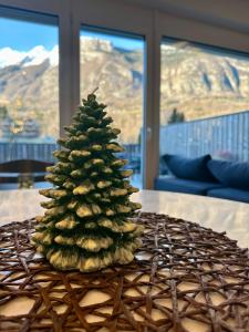 a christmas tree sitting on top of a table at Apartma 21 - Ajda in Bovec