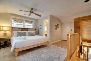 ein Schlafzimmer mit einem großen weißen Bett und einem Fenster in der Unterkunft 5 Forested Acres! Peaceful Retreat 4 Mi to Helen in Sautee Nacoochee