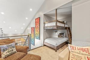 a living room with a bunk bed and a couch at Bear Claw 405 - Luxury Condo, Ski-in Ski-out Access, Slope Views & Winter Shuttle! in Steamboat Springs