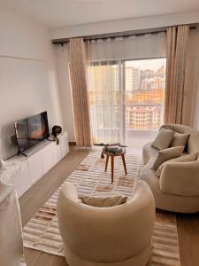 Μια τηλεόραση ή/και κέντρο ψυχαγωγίας στο Pinecrest View Deluxe One-Bedroom