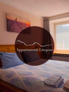 Ένα ή περισσότερα κρεβάτια σε δωμάτιο στο Appartamenti LITEGOSA casa vacanza 1