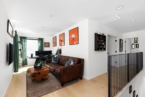 a living room with a leather couch and a table at Central Austin Oasis with Pool - Sleeps 9 in Austin