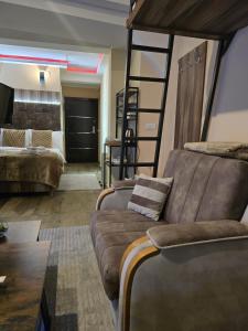 a living room with a couch and a bunk bed at Prime NG Mujen lux & spa in Cajetina +13 photos