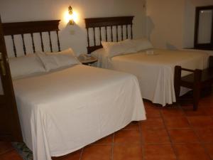 Voodi või voodid majutusasutuse Meson del Alferez Coatepec toas