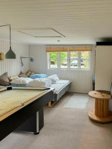 Ένα ή περισσότερα κρεβάτια σε δωμάτιο στο Comfortable Summer House In Aabenraa