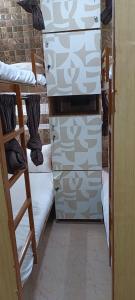 Ένα ή περισσότερα κρεβάτια σε δωμάτιο στο CHHATRAPATI SHIVAJI INTERNATIONAL DORMITORy