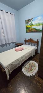 Ένα ή περισσότερα κρεβάτια σε δωμάτιο στο Casa doce Lar