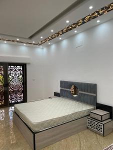 a bedroom with a large bed in a room at عمارة زكي الرمحي 6 in Amman +39 photos