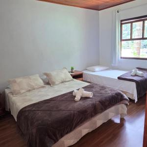 Giường trong phòng chung tại Pousada nas Montanhas de Teresopolis