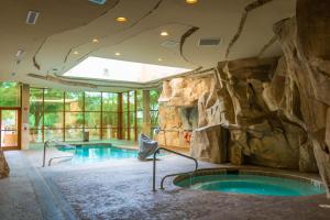 a large indoor pool with a rock wall at Gold Strike Casino Resort in Tunica Resorts