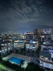 a city at night with a swimming pool at Moonlight Home in Nicosia