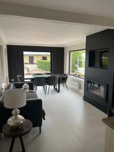 a living room with a couch and a fireplace at Bragan Mountain View in Monaghan