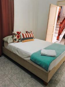 a large bed in a room with at Art House Getsemaní in Cartagena de Indias