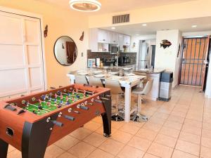 a kitchen with a chess board on a table at Princesa 3BR 2BA OV Penthouse- 502D in Campo del Medio +65 photos