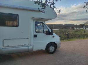 a white camper van parked in a parking lot at Autovan Alqueva in Aldeia do Mato +4 photos