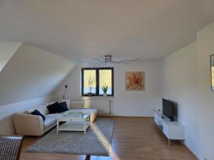 Χώρος καθιστικού στο Wohnung am Waldrand