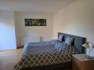 Ένα ή περισσότερα κρεβάτια σε δωμάτιο στο Wohnung am Waldrand