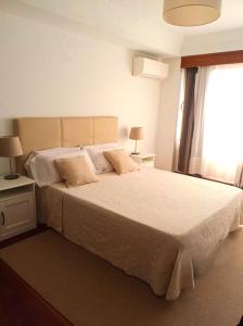 En eller flere senge i et værelse på Mallorca Town Center Lovely Apartment