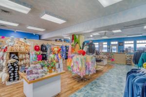 a store with a lot of clothes on display at Coastal Garden - Anchor Pier Lodge in Newport