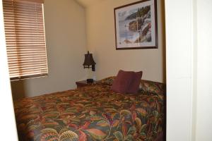 a bedroom with a bed and a window at Lighthouse Pointe Resort in Point Arena +22 photos