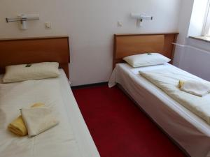 Ein Bett oder Betten in einem Zimmer der Unterkunft Seminarhaus Europäische Akademie